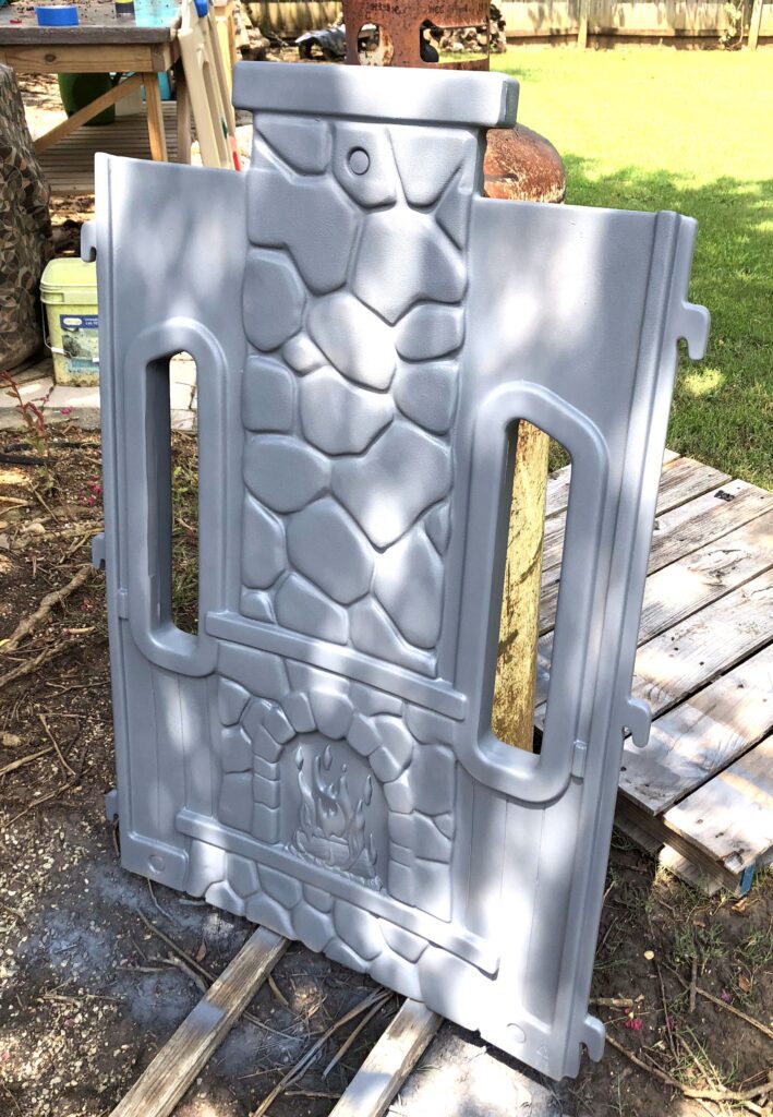 primed and painted portion of playhouse, waiting to have details painted.